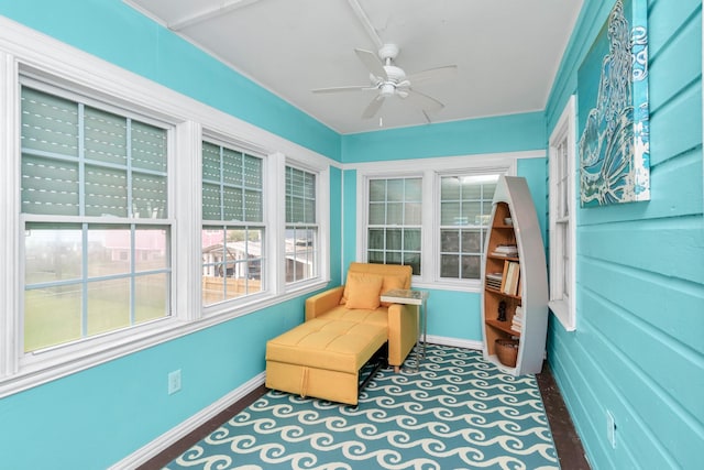 sunroom with ceiling fan