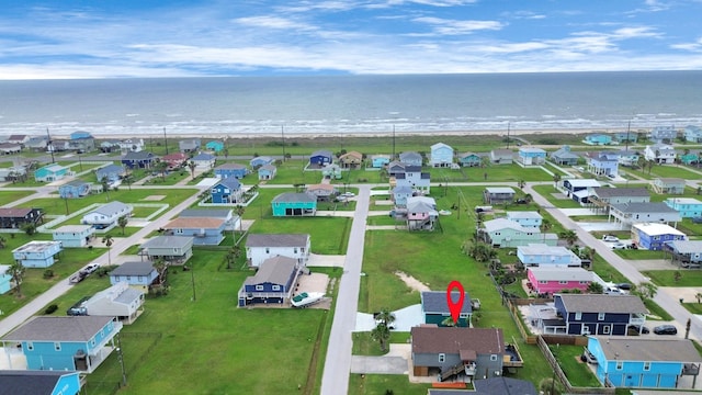 birds eye view of property with a residential view and a water view