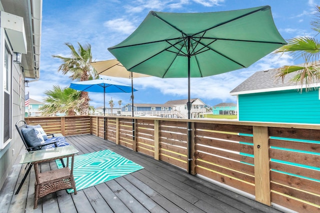 wooden deck featuring a residential view