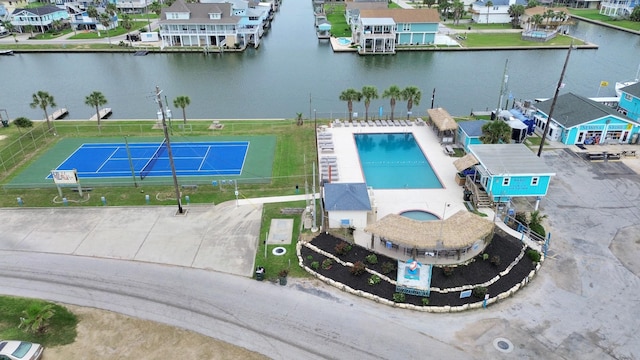 drone / aerial view featuring a water view and a residential view