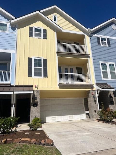 multi unit property with driveway and board and batten siding