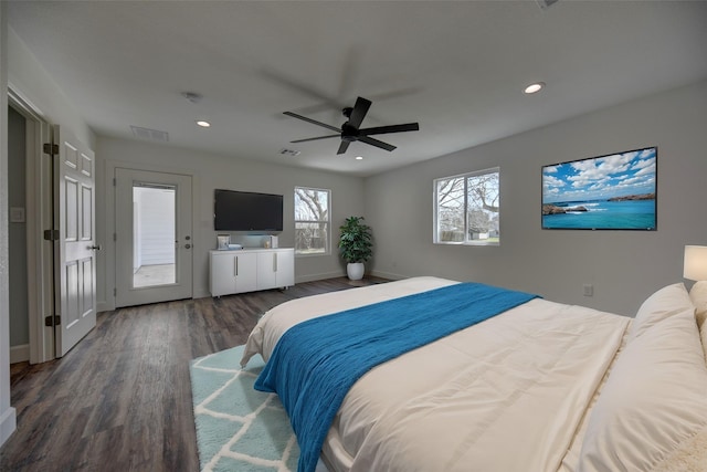 bedroom with baseboards, wood finished floors, visible vents, and recessed lighting