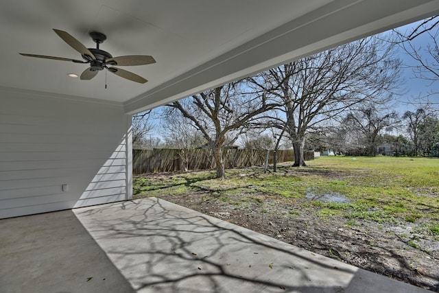 view of patio with fence and ceiling fan