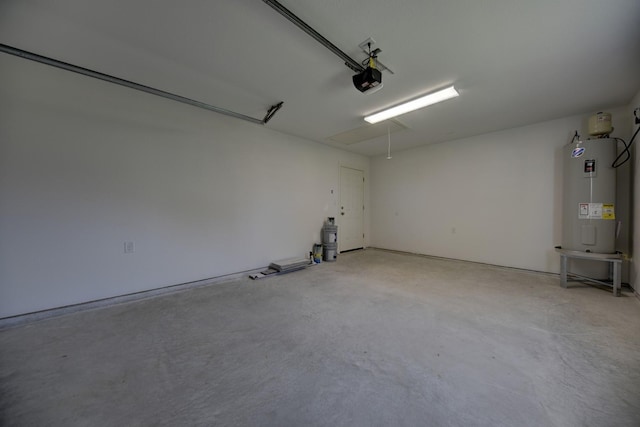 garage with electric water heater and a garage door opener