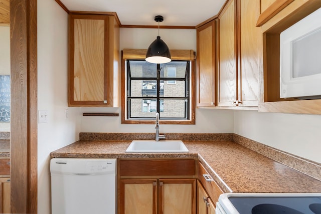 kitchen with dark countertops, white appliances, a sink, and hanging light fixtures