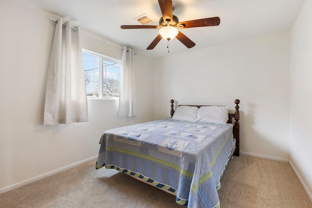 bedroom with carpet flooring, ceiling fan, visible vents, and baseboards