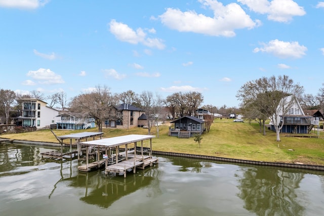 view of dock with a water view and a residential view