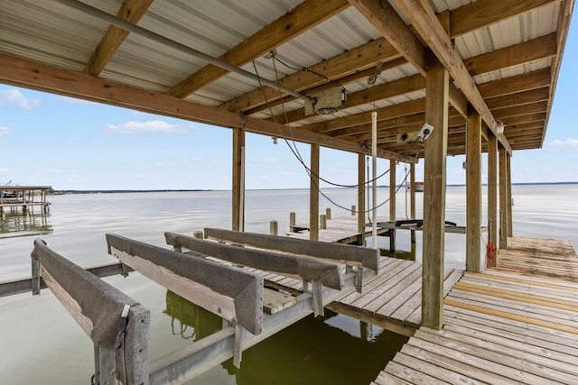 view of dock featuring a water view and boat lift