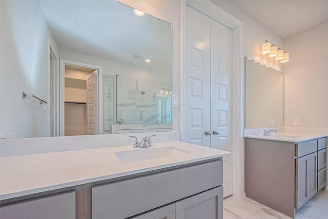 4046 Colony Ln, Missouri City, TX 77459 - bathroom featuring a sink, two vanities, a stall shower, and marble finish floor