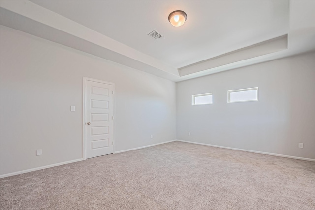 4046 Colony Ln, Missouri City, TX 77459 - empty room featuring visible vents, carpet flooring, baseboards, and a raised ceiling