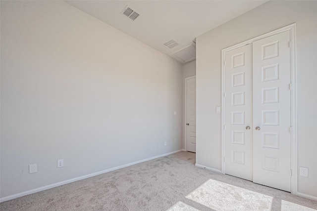 4046 Colony Ln, Missouri City, TX 77459 - unfurnished bedroom featuring visible vents, baseboards, a closet, and light carpet
