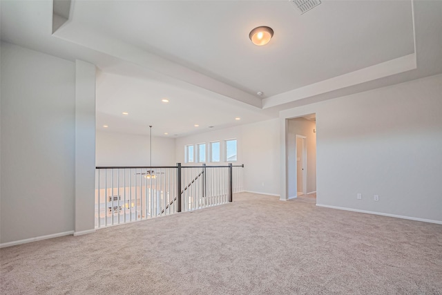 4046 Colony Ln, Missouri City, TX 77459 - carpeted empty room with visible vents, recessed lighting, a tray ceiling, and a chandelier