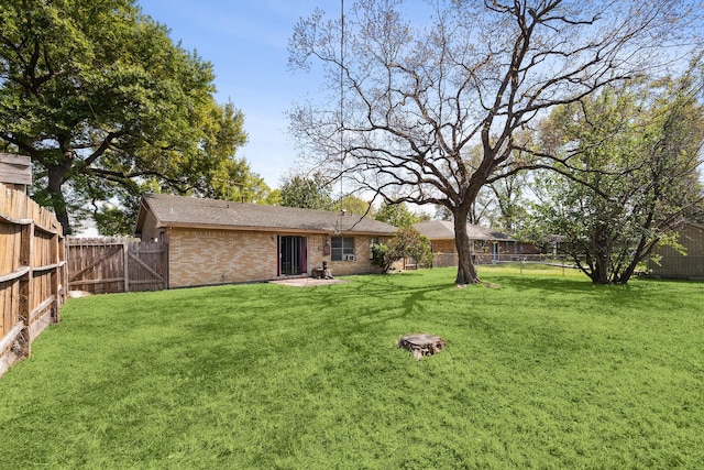 view of yard with a fenced backyard