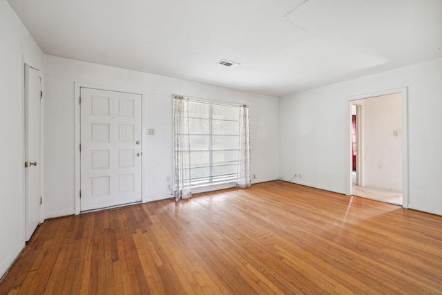 interior space featuring visible vents and hardwood / wood-style floors