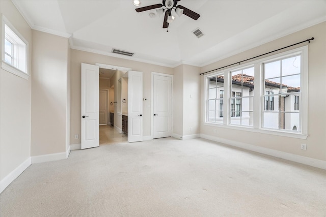 interior space with visible vents, baseboards, carpet flooring, and crown molding