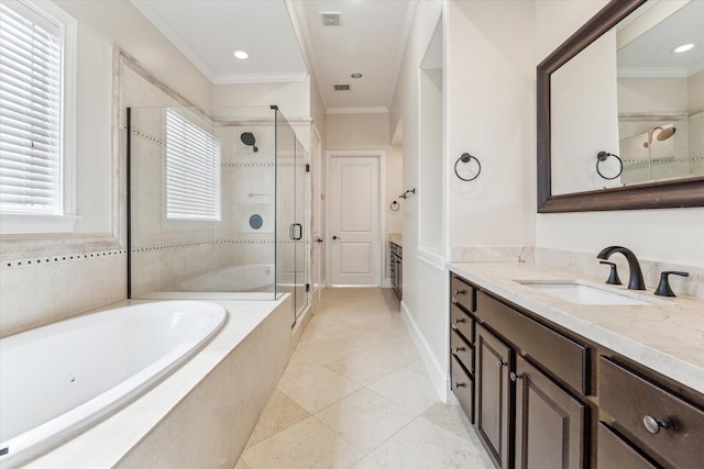 full bathroom with vanity, a garden tub, a shower stall, and crown molding