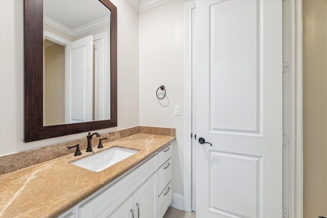 bathroom featuring vanity and crown molding