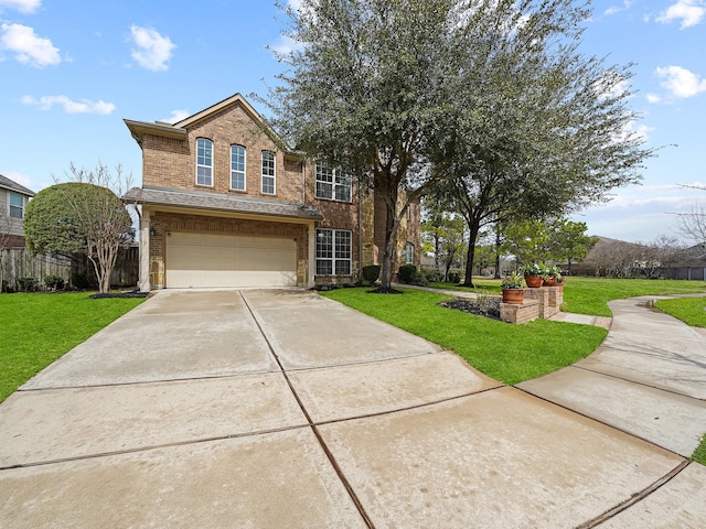 traditional-style house featuring driveway, a front lawn, an attached garage, and brick siding