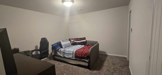 bedroom with baseboards and carpet flooring