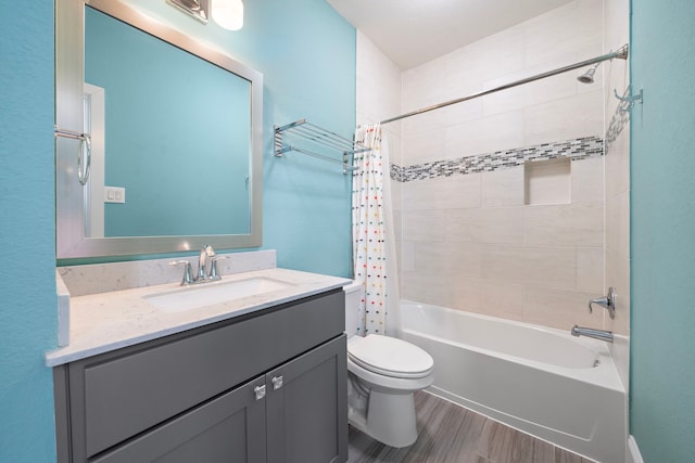 bathroom featuring vanity, wood finished floors, toilet, and shower / tub combo with curtain