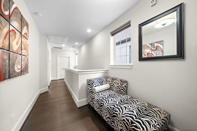 hallway featuring recessed lighting, visible vents, baseboards, dark wood finished floors, and attic access