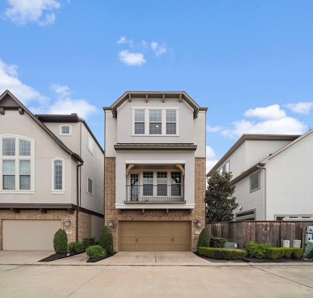 view of front of house featuring a garage, concrete driveway, and brick siding