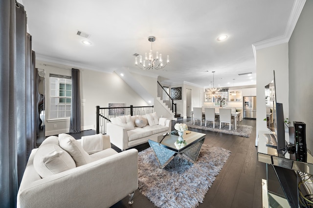 living area with crown molding, visible vents, dark wood finished floors, and a notable chandelier