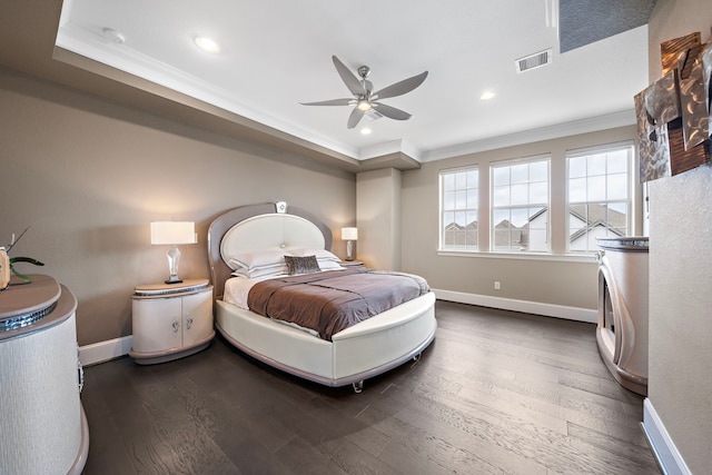 bedroom with baseboards, visible vents, wood finished floors, and ornamental molding