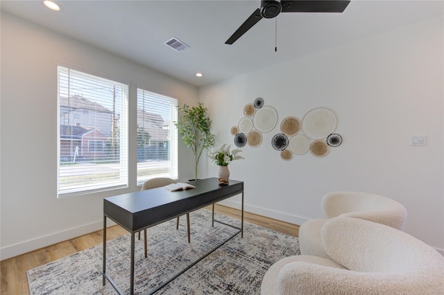 home office featuring light wood-style floors, recessed lighting, visible vents, and baseboards