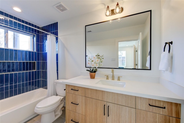 full bath with visible vents, toilet, tile patterned flooring, shower / bath combination with curtain, and vanity