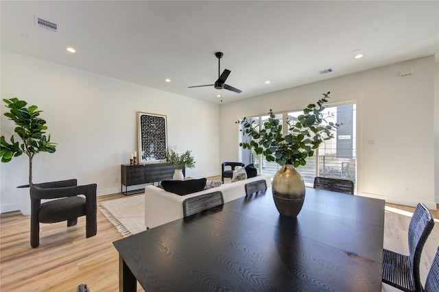 dining area with light wood-style floors, recessed lighting, visible vents, and a ceiling fan