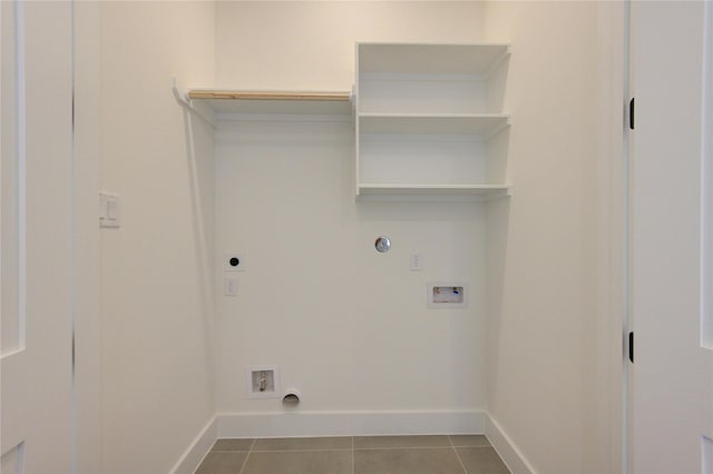 washroom with laundry area, baseboards, dark tile patterned floors, washer hookup, and electric dryer hookup