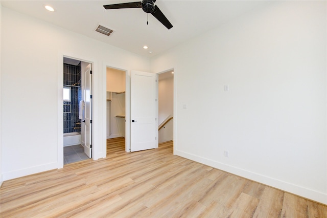 unfurnished bedroom with recessed lighting, wood finished floors, visible vents, and baseboards