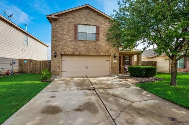 traditional-style house featuring concrete driveway, an attached garage, fence, a front lawn, and brick siding