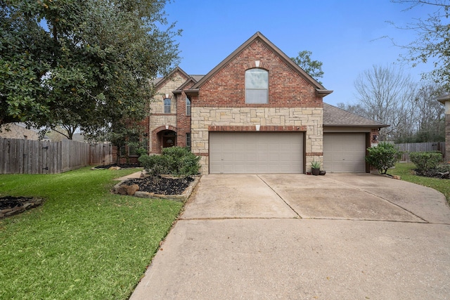 traditional-style home with brick siding, a front lawn, and fence