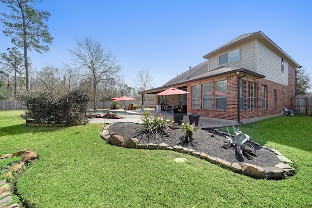 view of yard with a fenced backyard, a fenced in pool, and a patio