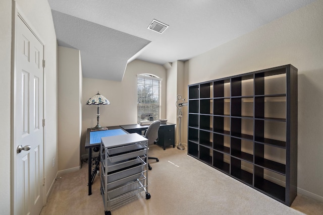 office space with carpet, visible vents, a textured ceiling, and baseboards