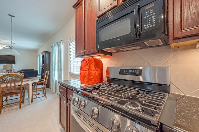 kitchen with black microwave, open floor plan, decorative backsplash, stainless steel gas stove, and brown cabinetry