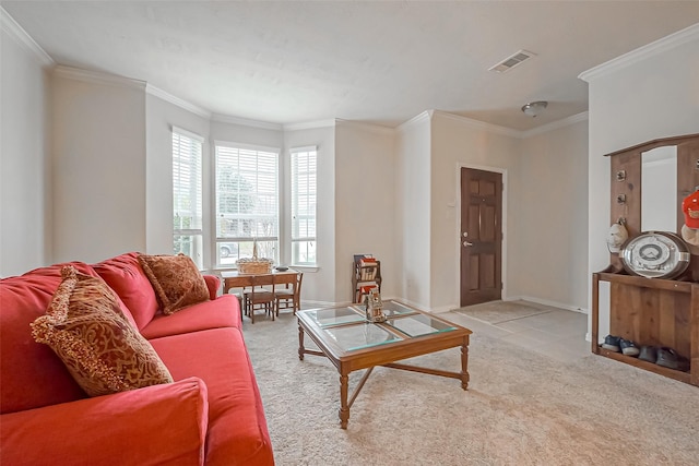 living area with carpet floors, visible vents, ornamental molding, and baseboards