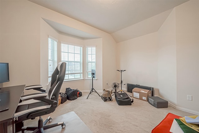 office area with carpet floors, lofted ceiling, and baseboards