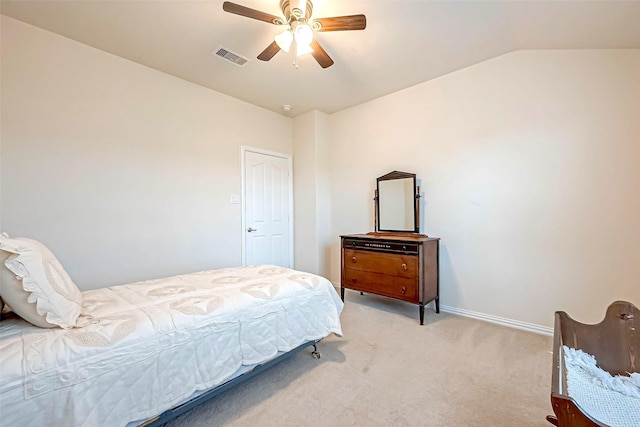 bedroom with visible vents, light carpet, vaulted ceiling, ceiling fan, and baseboards