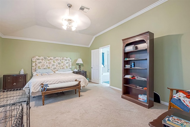 carpeted bedroom with baseboards, visible vents, connected bathroom, vaulted ceiling, and crown molding