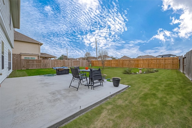 view of yard featuring a patio and a fenced backyard