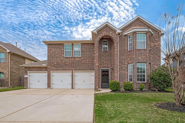 traditional home with a garage, brick siding, driveway, and a front lawn