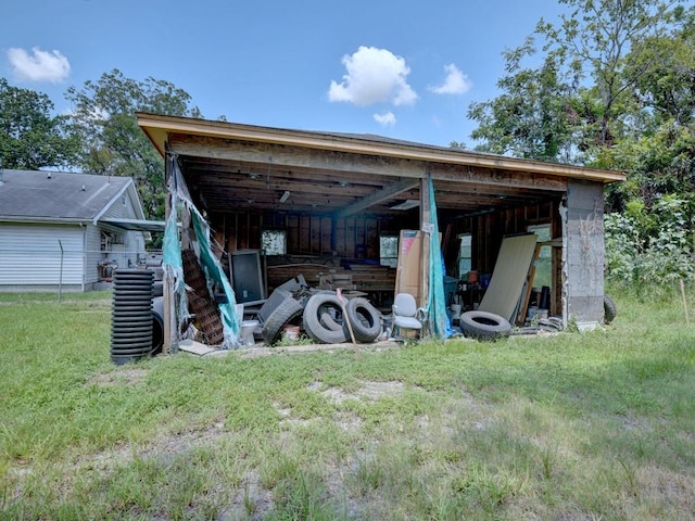 view of pole building with a lawn