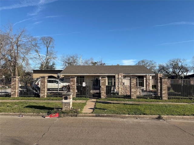 view of front of property featuring a fenced front yard, brick siding, and roof with shingles