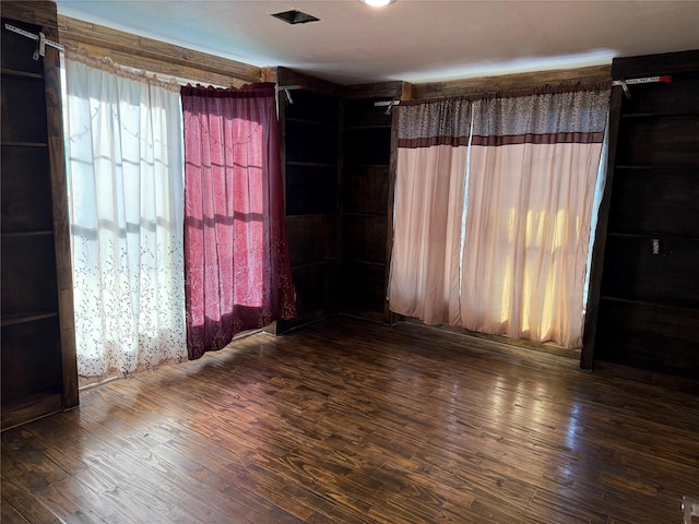 empty room featuring wood finished floors