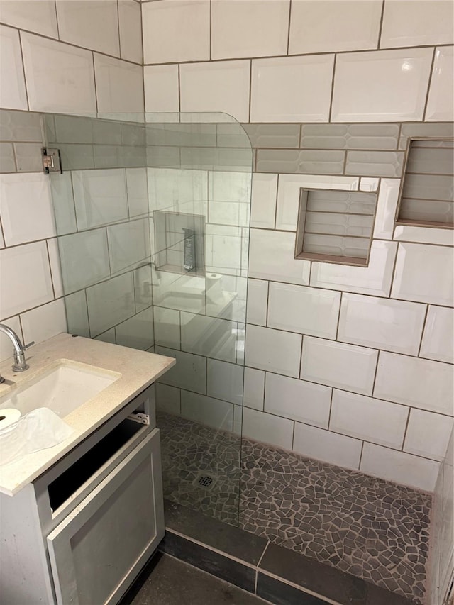 bathroom featuring vanity and a walk in shower