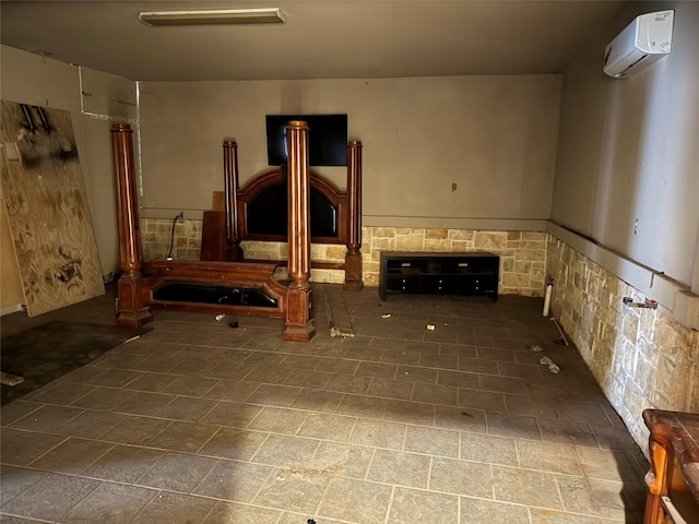 unfurnished living room featuring a wall mounted AC