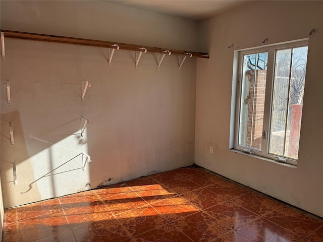 empty room with tile patterned flooring